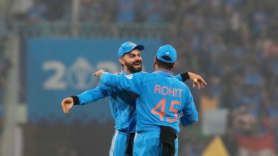 Rohit Sharma with Virat Kohli celebrate after winning the ICC Men's Cricket World Cup 2023 match against England(PTI)
