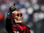 A person dressed for the day of the dead is pictured during the drivers parade ahead of the race REUTERS/Raquel Cunha