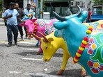 People walk by statues of oxen displayed outside a market at Little India district in Singapore, ahead of Hindu festive celebration of Diwali, locally known as Deepavali. Singapore witnesses a surge in Indian tourist arrivals 