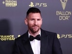 Lionel Messi poses before the awards.