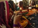 Married women observe a nirjala fast on Karwa Chauth for their husbands' long life and break it by worshipping the Moon. 