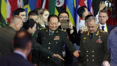China's Central Military Commission Vice Chairman Zhang Youxia and Russian Defence Minister Sergei Shoigu arrive for the Beijing Xiangshan Forum on October 30. (Reuters)