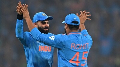 Virat Kohli (L) and captain Rohit Sharma celebrate their victory at the end of the 2023 ICC Men's Cricket World Cup match between India and England. (AFP) Virat Kohli (L) and captain Rohit Sharma celebrate their victory at the end of the 2023 ICC Men's Cricket World Cup match between India and England. (AFP)