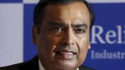 FILE- In this Aug. 12, 2019 file photo, Chairman of Reliance Industries Limited Mukesh Ambani, center, with wife Neeta Ambani arrives for 42nd Annual General Meeting of Reliance Industries Limited in Mumbai, India. Facebook says it plans to invest $5.7 billion in India’s telecom giant Reliance Jio. The investment will give Facebook a 9.99% stake in Jio Platforms, the digital technologies and app developing division of Reliance Industries. Ambani, Reliance’s head and India’s richest man, said that he is “humbled” to have Facebook as a long-term partner, and that the investment will help propel India’s digital push forward. (AP Photo/Rajanish Kakade, File) (AP) FILE- In this Aug. 12, 2019 file photo, Chairman of Reliance Industries Limited Mukesh Ambani, center, with wife Neeta Ambani arrives for 42nd Annual General Meeting of Reliance Industries Limited in Mumbai, India. Facebook says it plans to invest $5.7 billion in India’s telecom giant Reliance Jio. The investment will give Facebook a 9.99% stake in Jio Platforms, the digital technologies and app developing division of Reliance Industries. Ambani, Reliance’s head and India’s richest man, said that he is “humbled” to have Facebook as a long-term partner, and that the investment will help propel India’s digital push forward. (AP Photo/Rajanish Kakade, File) (AP)
