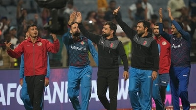 Afghanistan's players acknowledge the crowd after winning their match against Sri Lanka during the ICC Men's Cricket World Cup match in Pune (AP) Afghanistan's players acknowledge the crowd after winning their match against Sri Lanka during the ICC Men's Cricket World Cup match in Pune (AP)