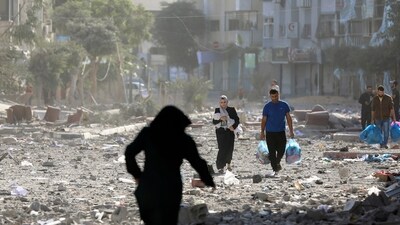 Israel-Hamas War: Palestinians leave their homes following Israeli bombardment on Gaza City. (AP) Israel-Hamas War: Palestinians leave their homes following Israeli bombardment on Gaza City. (AP)