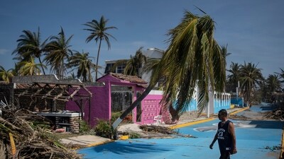 A man walks past at a damaged area in the aftermath of Hurricane Otis in Acapulco, Mexico on October 29. (AP) A man walks past at a damaged area in the aftermath of Hurricane Otis in Acapulco, Mexico on October 29. (AP)