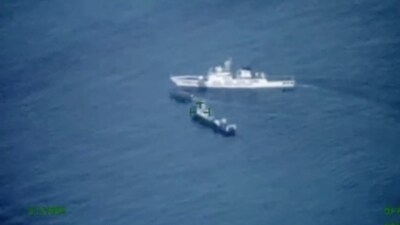 In this image released by the Armed Forces of the Philippines, a Philippines supply boat, center, sails near a Chinese coast guard ship, top, and a Chinese militia vessel off Second Thomas Shoal, (AP) In this image released by the Armed Forces of the Philippines, a Philippines supply boat, center, sails near a Chinese coast guard ship, top, and a Chinese militia vessel off Second Thomas Shoal, (AP)
