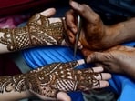 Prepare a mixture of henna powder, lemon juice, and a few drops of eucalyptus oil. This blend not only ensures a darker stain but also nourishes and strengthens your nails