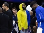 James Harden looks on during a timeout