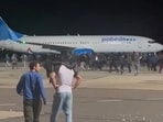 This frame grab taken from video footage shows protestors on the apron area of an airport in Makhachkala.