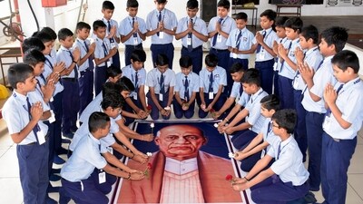 Students of Gyanganga Vidyalaya pays tribute to Sardar Vallabhbhai Patel on the eve of his birth anniversary, in Surat on Monday. (ANI) Students of Gyanganga Vidyalaya pays tribute to Sardar Vallabhbhai Patel on the eve of his birth anniversary, in Surat on Monday. (ANI)