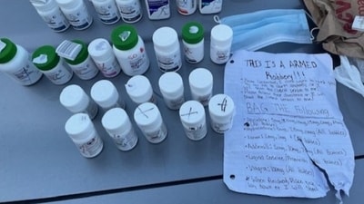 The handwritten threat note and drugs robbed by the Florida man (X(formerly Twitter)/@OrlandoPolice) The handwritten threat note and drugs robbed by the Florida man (X(formerly Twitter)/@OrlandoPolice)