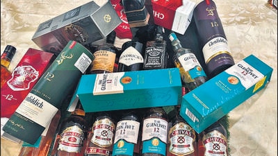 HT reported how traders buy used, high-end liquor bottles from scrap dealers, fill them with cheap whisky, slap on new labels and caps, seal them and sell them to vendors, shops. (HT photo) HT reported how traders buy used, high-end liquor bottles from scrap dealers, fill them with cheap whisky, slap on new labels and caps, seal them and sell them to vendors, shops. (HT photo)