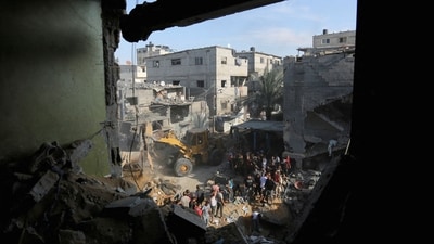 Palestinians conduct search and rescue works at the site of an Israeli strike on a house in Rafah in the southern Gaza Strip (REUTERS)
