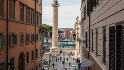 Pedestrians pass Traian's Column in Piazza Venezia in downtown Rome, Italy. (Bloomberg) Pedestrians pass Traian's Column in Piazza Venezia in downtown Rome, Italy. (Bloomberg)