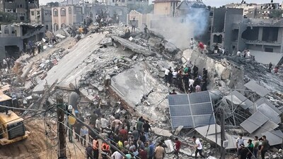 Israel-Hamas War: Palestinians look for survivors following Israeli airstrike in Nusseirat refugee camp, Gaza Strip. (AP)