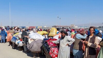 Afghan citizens wait with their belongings to cross into Afghanistan, after Pakistan gives the last warning to undocumented immigrants to leave, at the Friendship Gate of Chaman Border Crossing. (Reuters)