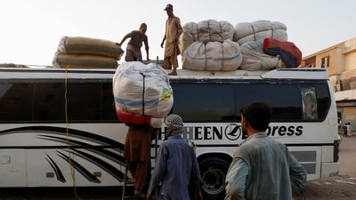 Afghan men load their belongings as they prepare to return home, after Pakistan gave the last warning to undocumented migrants to leave, at a bus stop in Karachi, Pakistan October 25, 2023. REUTERS/Akhtar Soomro (REUTERS)