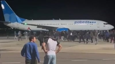 This frame grab taken from video footage shows protestors on the apron area of an airport in Makhachkala. (AFP) This frame grab taken from video footage shows protestors on the apron area of an airport in Makhachkala. (AFP)