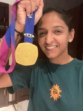 Harmanpreet Kaur with her Asian Games gold medal (Speacial arrangement) Harmanpreet Kaur with her Asian Games gold medal (Speacial arrangement)