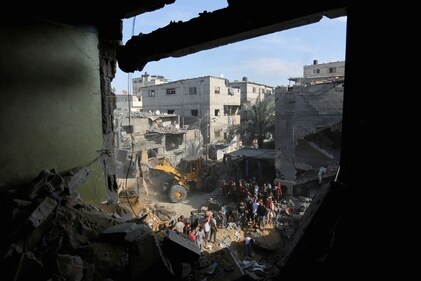 Palestinians conduct search and rescue works at the site of an Israeli strike on a house in Rafah in the southern Gaza Strip, October 30, 2023. (Reuters)