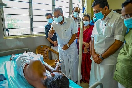 Kerala Chief Minister Pinarayi Vijayan meets an injured victim of Kalamaseri Samra Convention Center explosion at the Ernakulam Medical College in Kochi on October 31. (PTI) Kerala Chief Minister Pinarayi Vijayan meets an injured victim of Kalamaseri Samra Convention Center explosion at the Ernakulam Medical College in Kochi on October 31. (PTI)
