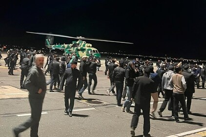 People in the crowd walk shouting antisemitic slogans at an airfield of the airport in Makhachkala, Russia, Monday, Oct. 30, 2023. (AP) People in the crowd walk shouting antisemitic slogans at an airfield of the airport in Makhachkala, Russia, Monday, Oct. 30, 2023. (AP)