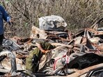 Israeli army soldiers inspect some of the hundreds of burnt vehicles that were destroyed in the October 7 attack. Israeli army soldiers inspect some of the hundreds of burnt vehicles that were destroyed in the October 7 attack.