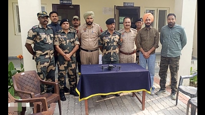 Border Security Force (BSF) along with Punjab Police recover a quadcopter drone from the farming field adjacent to the Mahwa village in Amritsar on Wednesday. (ANI) Border Security Force (BSF) along with Punjab Police recover a quadcopter drone from the farming field adjacent to the Mahwa village in Amritsar on Wednesday. (ANI)