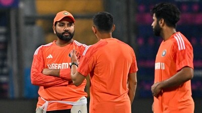 India's captain Rohit Sharma (L) speaks with teammates during a practice session (AFP) India's captain Rohit Sharma (L) speaks with teammates during a practice session (AFP)