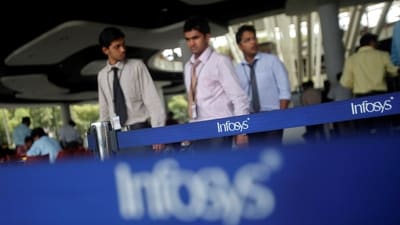 Employees of Indian software company Infosys walk past Infosys logos at their campus in the Electronic City area in Bengaluru September 4. (REUTERS)