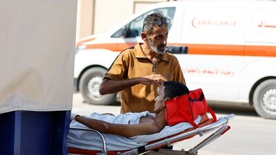 The evacuees were driven in ambulances through the Rafah border crossing.&nbsp; (REUTERS)