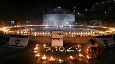 People gather and light candles to show solidarity with Israel and remember the victims following an attack by Hamas terrorists from Gaza, at Dizengoff square in Tel Aviv, Israel. (Reuters) People gather and light candles to show solidarity with Israel and remember the victims following an attack by Hamas terrorists from Gaza, at Dizengoff square in Tel Aviv, Israel. (Reuters)
