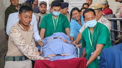 Mortal remains of a Manipur Police officer, Chingtham Anand, being shifted to JNIMS mortuary, who was killed in a fresh onslaught by suspected Kuki militants at conflict-torn Manipur's Moreh, in Tengnoupal district, Tuesday morning. (PTI) Mortal remains of a Manipur Police officer, Chingtham Anand, being shifted to JNIMS mortuary, who was killed in a fresh onslaught by suspected Kuki militants at conflict-torn Manipur's Moreh, in Tengnoupal district, Tuesday morning. (PTI)
