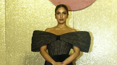 Bhumi Pednekar, too, attended the event in an all-black attire, complemented by a neatly tied-up bun hairstyle. (PTI) Bhumi Pednekar, too, attended the event in an all-black attire, complemented by a neatly tied-up bun hairstyle. (PTI)