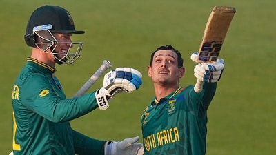Quinton de Kock celebrates his century with Rassie van der Dussen during the ICC Men's Cricket World Cup 2023 match between New Zealand and South Africa (PTI) Quinton de Kock celebrates his century with Rassie van der Dussen during the ICC Men's Cricket World Cup 2023 match between New Zealand and South Africa (PTI)