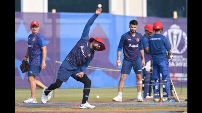 Rashid Khan (left) bowls as pacer Naveen-ul-Haq (right) watches him during Afghanistan’s training session in Lucknow on Wednesday. (Deepak Gupta/HT) Rashid Khan (left) bowls as pacer Naveen-ul-Haq (right) watches him during Afghanistan’s training session in Lucknow on Wednesday. (Deepak Gupta/HT)