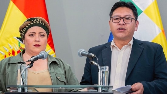 Bolivia's deputy Foreign Minister Freddy Mamani (R) speaks next to the minister of the presidency Maria Nela Prada, during a press conference announcing that Bolivia will break relations with Israel, on October 31, 2023, at the Casa Grande del Pueblo government palace in La Paz, Bolivia. (AFP)