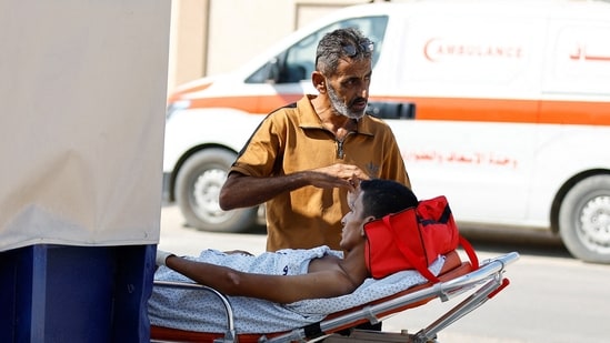 The evacuees were driven in ambulances through the Rafah border crossing.&nbsp;(REUTERS)