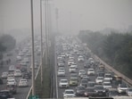Vehicles ply on Delhi-Gurugram Expressway amid a thick layer of smog, in Gurugram on Thursday. (ANI Photo)