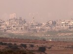 A picture taken from the Israeli side of the border with the Gaza Strip on shows destroyed buildings in the Gaza Strip A picture taken from the Israeli side of the border with the Gaza Strip on shows destroyed buildings in the Gaza Strip