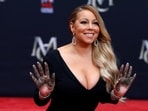 Singer Mariah Carey shows her hands after placing them in cement in the forecourt of the TCL Chinese theatre in Los Angeles. 