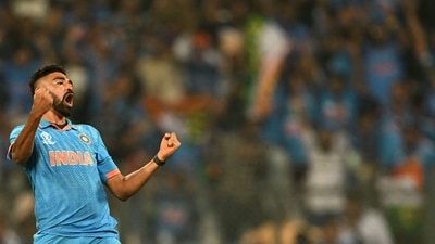 Mohammed Siraj celebrates after taking the wicket of Dimuth Karunaratne during the 2023 ICC Men's Cricket World Cup match between India and Sri Lanka at the Wankhede Stadium (AFP) Mohammed Siraj celebrates after taking the wicket of Dimuth Karunaratne during the 2023 ICC Men's Cricket World Cup match between India and Sri Lanka at the Wankhede Stadium (AFP)