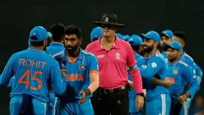 India's Rohit Sharma, Jasprit Bumrah and teammates celebrate after the World Cup match (REUTERS)