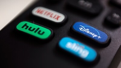 FILE - The logos for streaming services Netflix, Hulu, Disney Plus and Sling TV are pictured on a remote control on Aug. 13, 2020, in Portland, Ore. Walt Disney Co. said it will acquire a 33% stake in Hulu from Comcast for approximately $8.6 billion, a deal that will give Disney undisputed control of the streaming service. (AP) FILE - The logos for streaming services Netflix, Hulu, Disney Plus and Sling TV are pictured on a remote control on Aug. 13, 2020, in Portland, Ore. Walt Disney Co. said it will acquire a 33% stake in Hulu from Comcast for approximately $8.6 billion, a deal that will give Disney undisputed control of the streaming service. (AP)