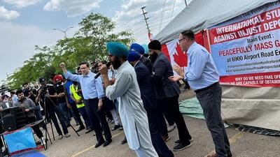 Ex-international students from India during a protest at a site in the Greater Toronto Area in June where they were joined by politicians like Conservative Party leader Pierre Poilievre (seen with hand raised). (Supplied photo)