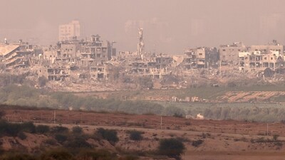 A picture taken from the Israeli side of the border with the Gaza Strip on shows destroyed buildings in the Gaza Strip (AFP) A picture taken from the Israeli side of the border with the Gaza Strip on shows destroyed buildings in the Gaza Strip (AFP)