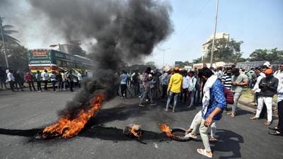 Maratha protesers block the Mumbai-Bengaluru highway. Karnataka has halted all bus services to Maharashtra after a bus from the Balki depot in Bidar district was set ablaze earlier this week. (HT Photo) Maratha protesers block the Mumbai-Bengaluru highway. Karnataka has halted all bus services to Maharashtra after a bus from the Balki depot in Bidar district was set ablaze earlier this week. (HT Photo)