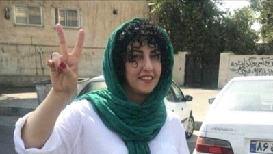 Iranian activist Narges Mohammadi, who won the Nobel Peace Prize, shows a victory sign. (Reuters)
